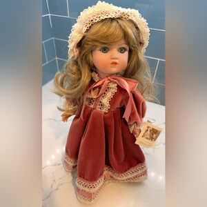 Classic Porcelain Doll in Dusty Rose Velvet Dress with Lace Bonnet